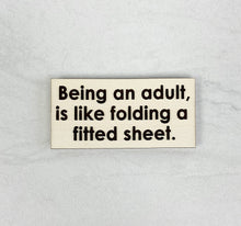 Load image into Gallery viewer, Being An Adult Is Like Folding A Fitted Sheet | Wooden Magnet | Magnet