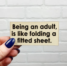 Load image into Gallery viewer, Being An Adult Is Like Folding A Fitted Sheet | Wooden Magnet | Magnet